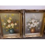 A pair of still life oils on canvas, flowers, in ornate gilt frames, 29cm x 39cm, unsigned.