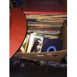 A box of vinyl records