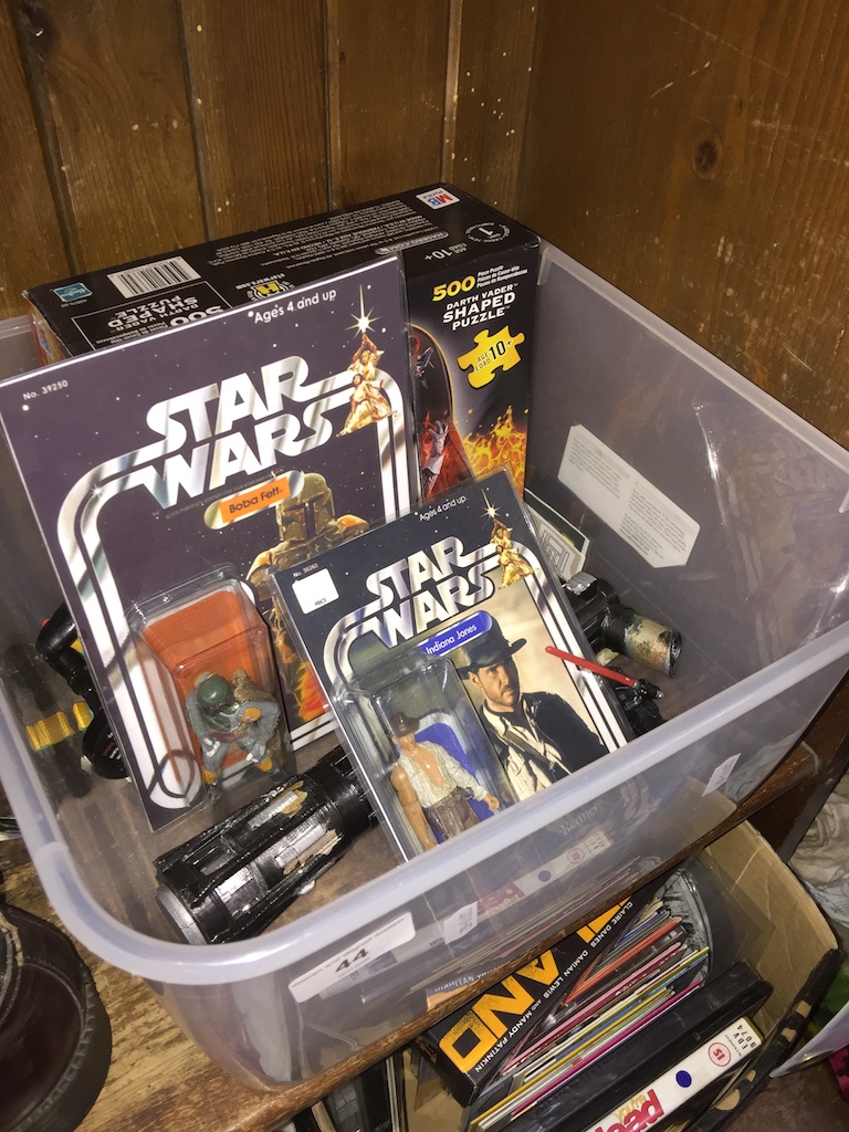 A crate of Star Wars style figures