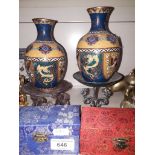A pair of cloisonne vases, a pair of oil burners, and two sets of health balls
