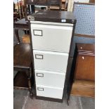 A metal 4 drawer filing cabinet