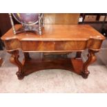 A Victorian mahogany side table with single drawer and scroll legs.