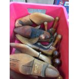 A box of wooden shoe maker's shoe trees.