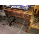 A Priory style oak side table with single drawer.