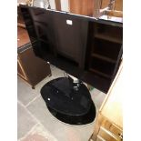 A Samsung UE40JU6400K 40" tv with remote on glass stand