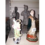 Three Chinese terracotta soldier figurines and two other eastern figurines