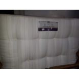 A Sealy double divan bed with Posturepedic mattress and padded headboard