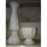 A white pottery jardinaire and stand