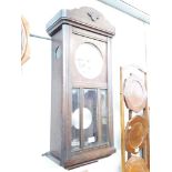 An oak cased wall clock (glass damaged)