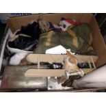 A box of mixed items including old flags and some military items
