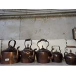 Five copper kettles