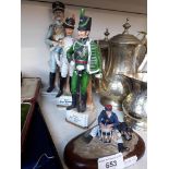 3 ceramic and a cast figure of military personnel