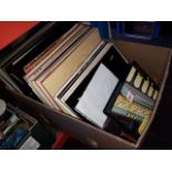 A box containing a quantity of vinyl LPs together with a few boxed cassettes - as listed