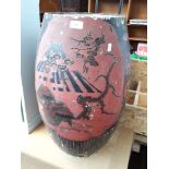 A large Japanese porcelain vase with cut down top, with laquered decoration depicting dragons,