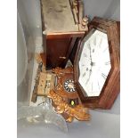 A cuckoo clock, 2 wall clocks and a glass eagle figurine