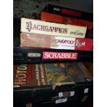 A box of boxed games and jigsaws