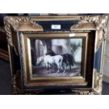 A reproduction print depicting two horses, i ornate reproduction frame, 24cm x 19cm.