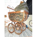 A wooden reproduction childs dolls pram