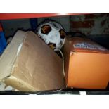 A box of assorted items, signed Watford FC football, collectors plates, Taiwanese boxed glove puppet