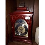 A reproduction Moon Phase Westminster chime table clock with brass and steel face by Franz Hermle