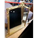 A large gilt framed over mantle mirror