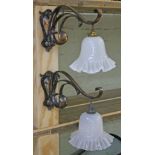A pair of Arts & Crafts wall lights in the manner of Benson with crimped and twisted milk glass