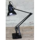 A Herbert Terry & Sons black anglepoise lamp.