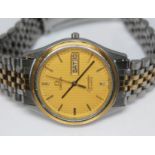 A 1984 stainless steel and gold plated Omega Seamaster Quartz day date wristwatch 1960245, with gold