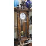 A late 19th century double weight driven Vienna wall clock, length 123cm.