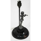 A table lamp with white metal figure depicting the pied piper, height 29cm.