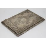 An early Victorian bright cut engraved card case decorated with floral scrolls and embossed edges,