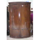 A George III mahogany bow front corner cabinet, height 120cm.