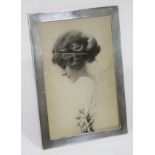 A hallmarked silver photo frame 29cm x 21cm.