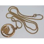 A hallmarked 9ct gold scorpio pendant on indistinctly marked chain, gross wt. 13.40g.