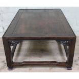A Chinese hardwood low table of rectangular form with pierced corner mouldings, square section