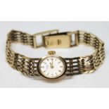 A hallmarked 9ct gold ladies Rotary wristwatch with 9ct gold strap, gross wt. 17.45g.