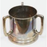 A silver three handled loving cup, Chester 1908, height 14cm, wt. 23oz. Condition - good, damage/