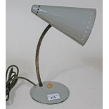 A retro grey bendy table lamp.
