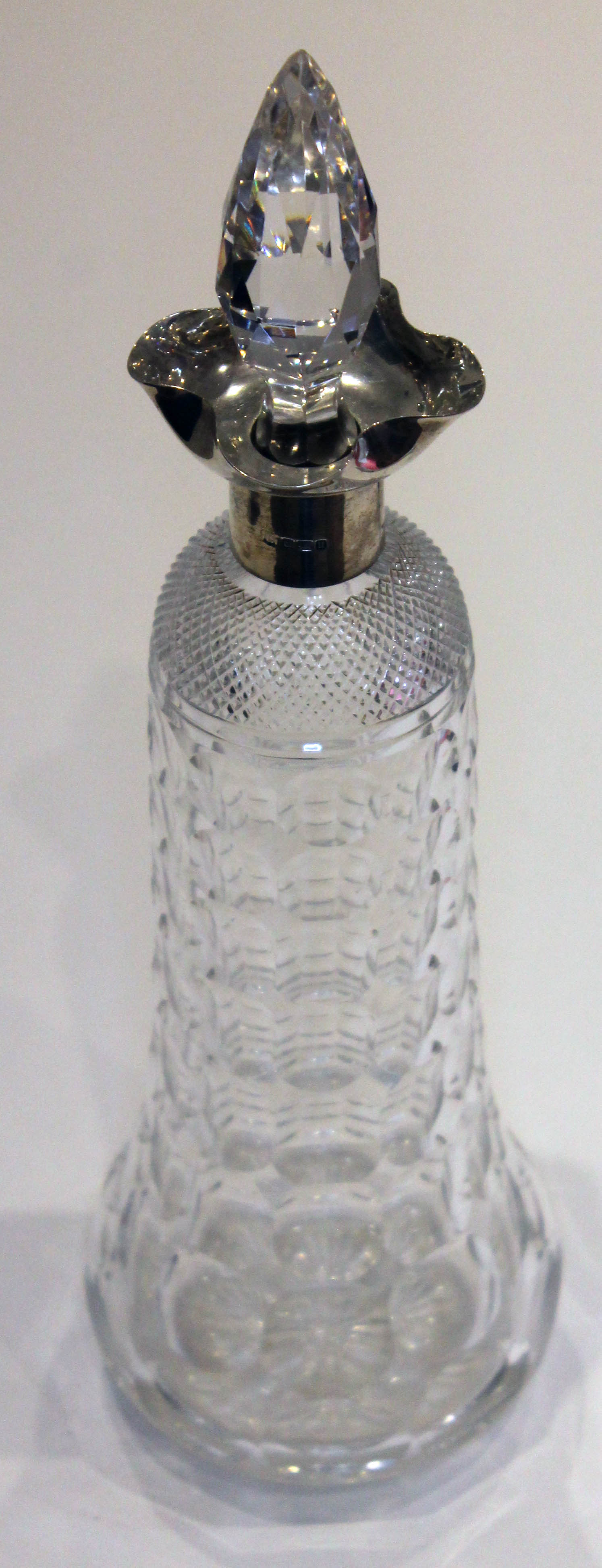 A silver mounted cut glass decanter, Cooper Brothers & Sons, Sheffield 1912, height 35cm.
