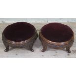 A pair of Victorian carved walnut foot stools.