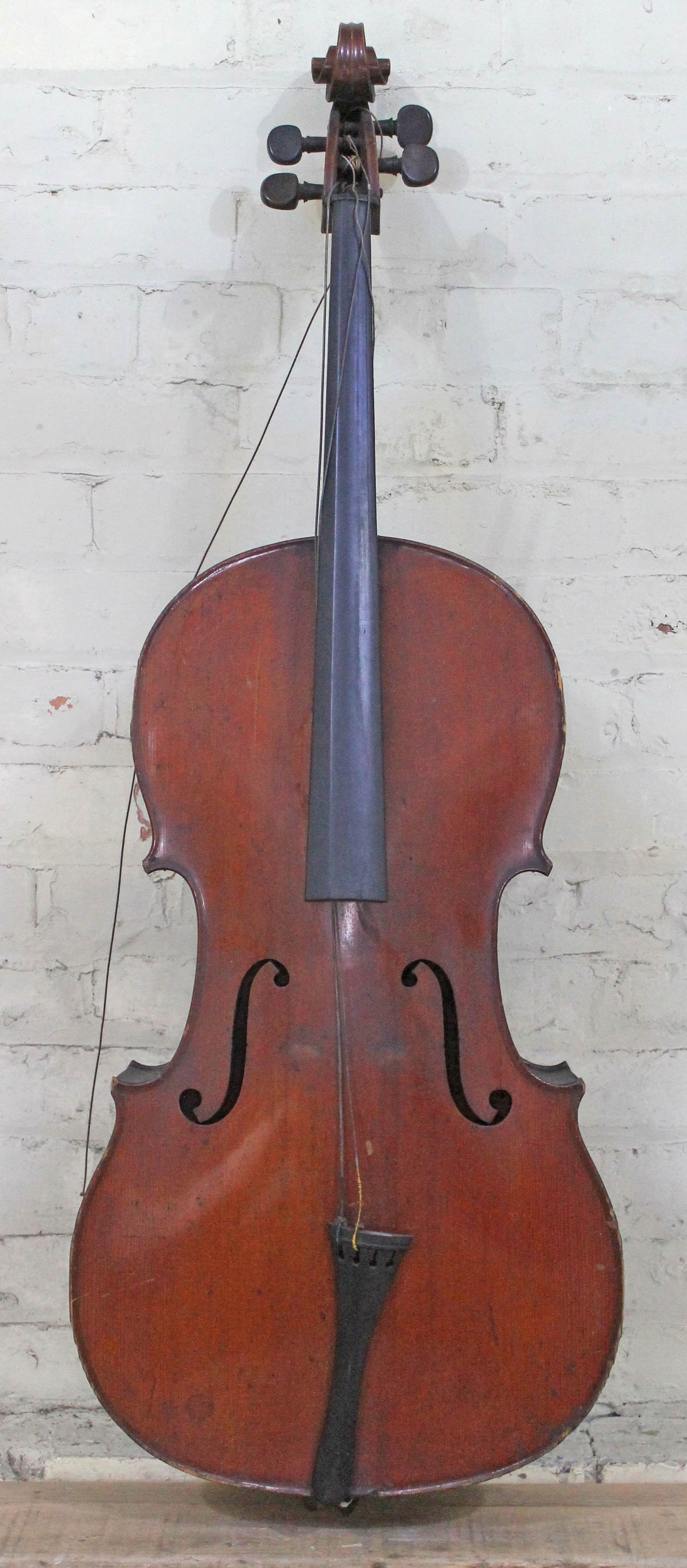 An antique cello, two piece flame maple back and sides, spruce top, length of back 79cm. Condition -