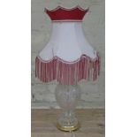 A large cut glass table lamp with brass fittings and vintage shade, height to top of bulb fitting