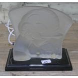 An Aat Deco style pressed glass light up ladies head in side profile on stand.
