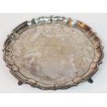 A hallmarked silver salver, wt. 10oz, diam. 21cm.