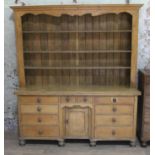 A 19th century pine dresser with oak handles and feet, later back, width 186cm, depth 58cm &