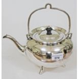A silver plated tea kettle in the manner of Christopher Dresser, height 24cm.