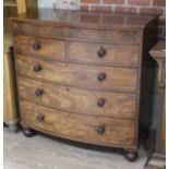 A bow front mahogany chest of drawers, second quarter of the 19th century, with turn handles and