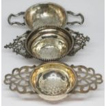 A group of three hallmarked silver tea strainers, wt. 3 1/2oz.