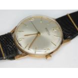 A 1960s hallmarked 9ct gold Roamer wristwatch with signed champagne dial, hands and hour markers