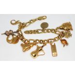 An Italian 18ct gold charm bracelet with seven 18ct gold charms, two 9ct gold charms, one 14ct